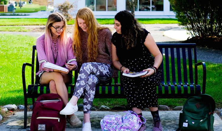 d809.com three female students studying on a bench on camp at Ocean County College